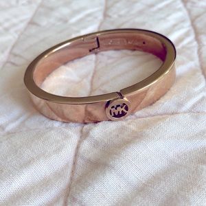 Rose gold colored Michael Kors bangle bracelet